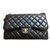 Timeless Chanel Classic Black pele de cordeiro Jumbo Flag bag Preto  ref.83500