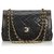 Chanel Black Medium Flap Bag mit Lammfellfutter Schwarz Leder  ref.129382