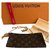 Bucket Louis Vuitton Clutch bags Brown Cloth  ref.132204