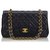 Timeless Chanel Black Classic Flap Bag forrada de piel de cordero mediana Negro Cuero  ref.141176