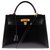 Superbe et rare joyau: Hermès Kelly sellier 32 cm à bandoulière en cuir box noir et accastillage plaqué or en excellente condition !  ref.144225