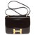 Hermès Hermes constance 23 En cuero box marrón, adornos de metal chapado en oro Castaño  ref.176968