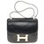 Hermès Hermes Constance 23 couro caixa preta, guarnição de metal banhado a ouro em muito bom estado Preto  ref.183947