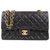 Chanel Black Classic Flap Bag forrada de piel de cordero mediana Negro Cuero  ref.192859