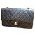 Timeless Vintage Chanel black lambskin medium classic flap bag Leather  ref.195145