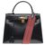 Superbe Hermès Kelly sellier 32cm en cuir box noir, bandoulière en sangle cavale rouge et noir, garniture en métal plaqué or, en très bel état !  ref.200768