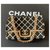Broche de sac à rabat classique en résine noire / blanche / or Chanel  ref.215203