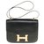 Espléndida Hermès Constance 23 caja de cuero negro, adornos de metal chapado en oro  ref.249683