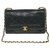 Timeless Bolsa Chanel Classique em pele de cordeiro acolchoada preta, garniture en métal doré Preto  ref.250077