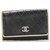 Porte-clés Chanel en cuir d'agneau noir CC Marron Beige  ref.250746