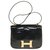 Herrliche Hermès Constance Umhängetasche aus schwarzem Porosus Krokodil, vergoldete Metallverkleidung Exotisches Leder  ref.251978