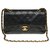 A bolsa Chanel Timeless muito procurada 23cm em couro preto acolchoado, garniture en métal doré  ref.259740