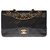 A bolsa Chanel Timeless muito procurada 23cm com aba forrada em couro preto acolchoado, garniture en métal doré  ref.266332