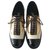 Chanel Zapatos Derby Brogue con cordones Castaño Negro Dorado Crema Cuero Charol  ref.269185
