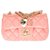 Classique Splendide et le très recherché sac Chanel Mini charms Flap bag en cuir matelassé rose, garniture en métal doré  ref.272531