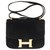 Raro bolso Hermès Constance 23 Ante negro, adornos de metal chapado en oro Gamuza  ref.275911