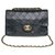 A bolsa Chanel Timeless muito procurada 23cm em couro acolchoado azul marinho com acabamento em metal dourado  ref.276227