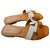 Sandalias Hermès Oran Blanco Bronce Cuero  ref.279339