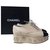 Chanel - Chaussures compensées camélia en cuir noir beige et métal Cuir vernis  ref.280184