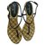 CHANEL Sandale nus pieds entre deux Spartiates cuir noir et dorées T40,5 IT  ref.283973