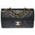 El codiciado bolso Chanel Timeless 23cm de cuero acolchado negro, guarnición en métal doré  ref.284996