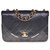 Timeless Magnífico bolso Chanel Classique en cuero acolchado negro con borde blanco, guarnición en métal doré  ref.289680