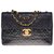A bolsa Maxi Jumbo Timeless Majestic Chanel em couro preto acolchoado, garniture en métal doré  ref.300808