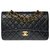 Chanel Timeless Medium handbag in black quilted lambskin, garniture en métal doré Leather  ref.307854