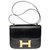 Hermès Esplêndida bolsa Hermes Constance 23 cm vintage em caixa preta, garniture en métal doré Preto Couro  ref.309387