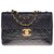 Classique Le Majestueux Sac à main Chanel Maxi Jumbo en cuir caviar matelassé noir, garniture en métal doré  ref.323691
