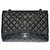 The Majestic Chanel Timeless Maxi jumbo shoulder bag in black quilted grained leather, Garniture en métal argenté  ref.332787