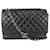 Chanel Cadena plateada Maxi Classic con solapa forrada en piel de cordero acolchada negra Cuero Plata  ref.340598