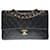 Hervorragende Chanel Timeless Medium Handtasche 25cm mit gefütterter Klappe aus schwarzem gestepptem Lammfell, garniture en métal doré Leder  ref.363593