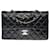 El codiciado bolso Chanel Timeless 23cm con solapa forrada en piel de cordero negra acolchada, Guarnición en métal argenté Negro Cuero  ref.367779