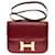 Hermès Esplêndida bolsa Hermes Constance 23 cm caixa de couro bordeaux, garniture en métal doré  ref.370755