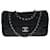 Hervorragende Chanel Timeless / Classique Handtasche mit einzelner Klappe aus schwarzem, gestepptem, schillerndem Stoff, Garniture en métal argenté Tuch  ref.388189