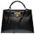 Hermès Exceptional Kelly 32 saddle with shoulder strap in black box leather , gold plated metal trim  ref.389658