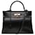 Exceptionnel Sac Hermès Kelly 35 retourné bandoulière en cuir box noir, garniture en métal plaqué or  ref.421424