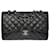 Le Majestueux Chanel Timeless Jumbo Flap bag shoulder bag in black quilted perforated leather, Garniture en métal argenté  ref.474211