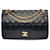 Espléndido bolso de mano Chanel Timeless/Classique con solapa forrada en piel de cordero acolchada negra, guarnición en métal doré Negro Cuero  ref.480421