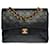 Die begehrte Chanel Timeless/Classique Tasche 25 cm mit gefütterter Klappe aus schwarzem gestepptem Leder, garniture en métal doré  ref.484346