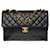 The Majestic Chanel Timeless Maxi Jumbo single flap bag in black quilted leather, garniture en métal doré  ref.489586