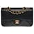 L'ambita borsa Chanel Timeless 23 cm con patta foderata in pelle nera, garniture en métal doré Nero  ref.495324