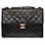 Majestic Chanel Timeless Jumbo single flap bag in black quilted leather, garniture en métal doré  ref.505686
