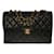 Magnificent & Rare Chanel Timeless/Classique lined-sided handbag in black quilted lambskin, garniture en métal doré Leather  ref.515225