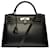 Hermès Extremely rare Hermes Kelly handbag 32 saddler shoulder strap in black epsom leather with white stitching, palladium silver metal trim  ref.515946