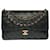 The coveted Chanel Timeless Medium bag 25 cm with lined flap in black leather, garniture en métal doré  ref.521122