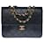 Très beau sac à main Chanel Classique flap bag en cuir matelassé noir, garniture en métal doré  ref.523940