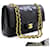 Chanel 2.55 Bolso de hombro mediano con cadena y solapa forrada Piel de cordero negra Negro Cuero  ref.529694