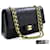 Chanel 2.55 Bolso de hombro mediano con cadena y solapa forrada Piel de cordero negra Negro Cuero  ref.529696